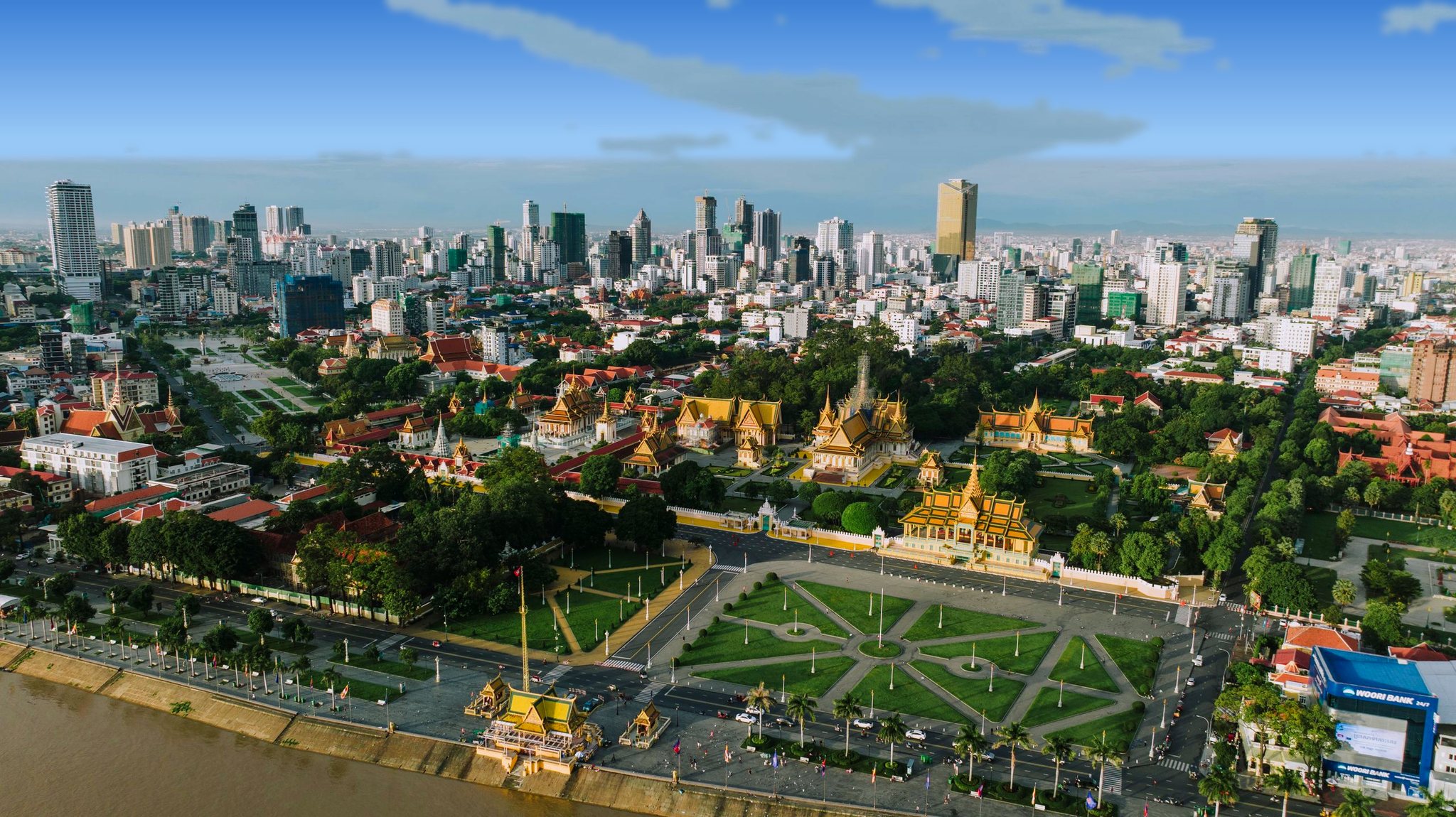 Aerial view of the Royal Palace and the Phnom Penh skyline on a bright day